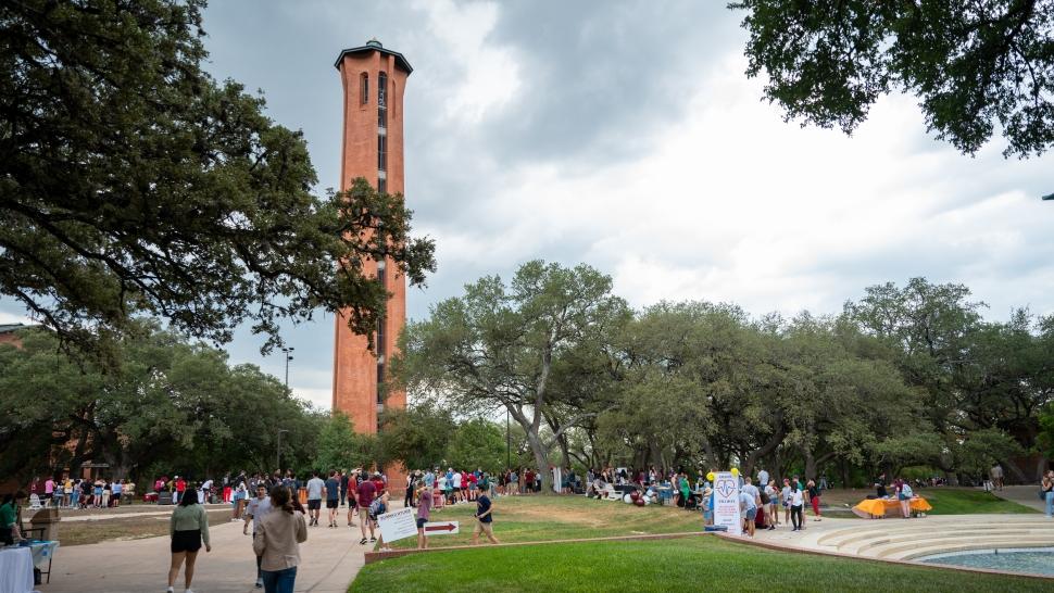 Students gather during an event by the Tower