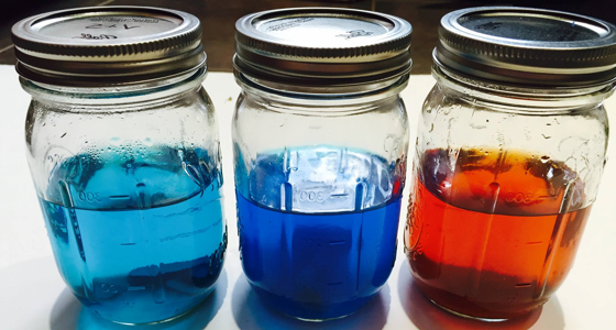 Mason jars with colored liquid research experiments