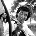 Victor Jara with guitar black and white photo